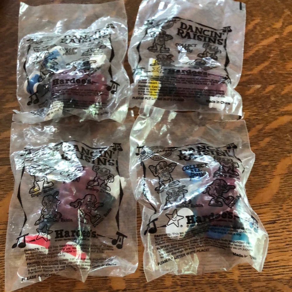 Hardee’s collectible dancing raisins still in the package. 2 inch figures